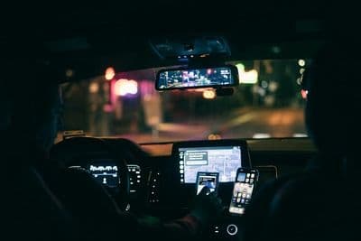 Rideshare driver using their phone
