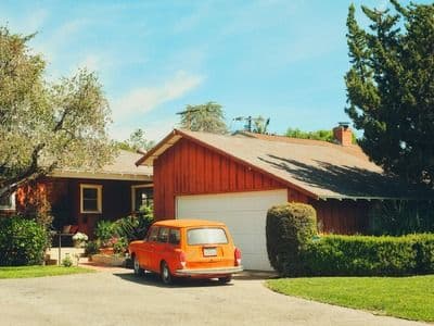 car parked outside of a house 