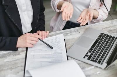 Two People discussing General Liability Insurance